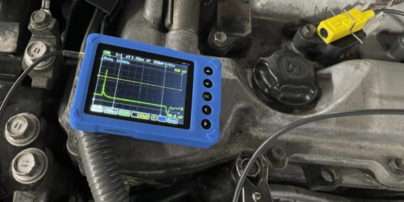 Automotive oscilloscope diagnosing an auto electrical fault on an engine